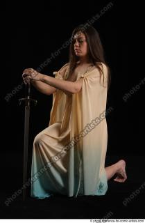 06 2018 01 BARBORA KNEELING POSES WITH SWORD